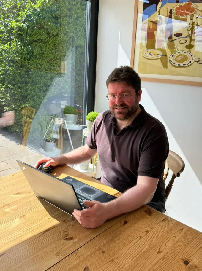 Andrew Clark, who runs Solar Search Marketing, at his desk in Leicestershire
